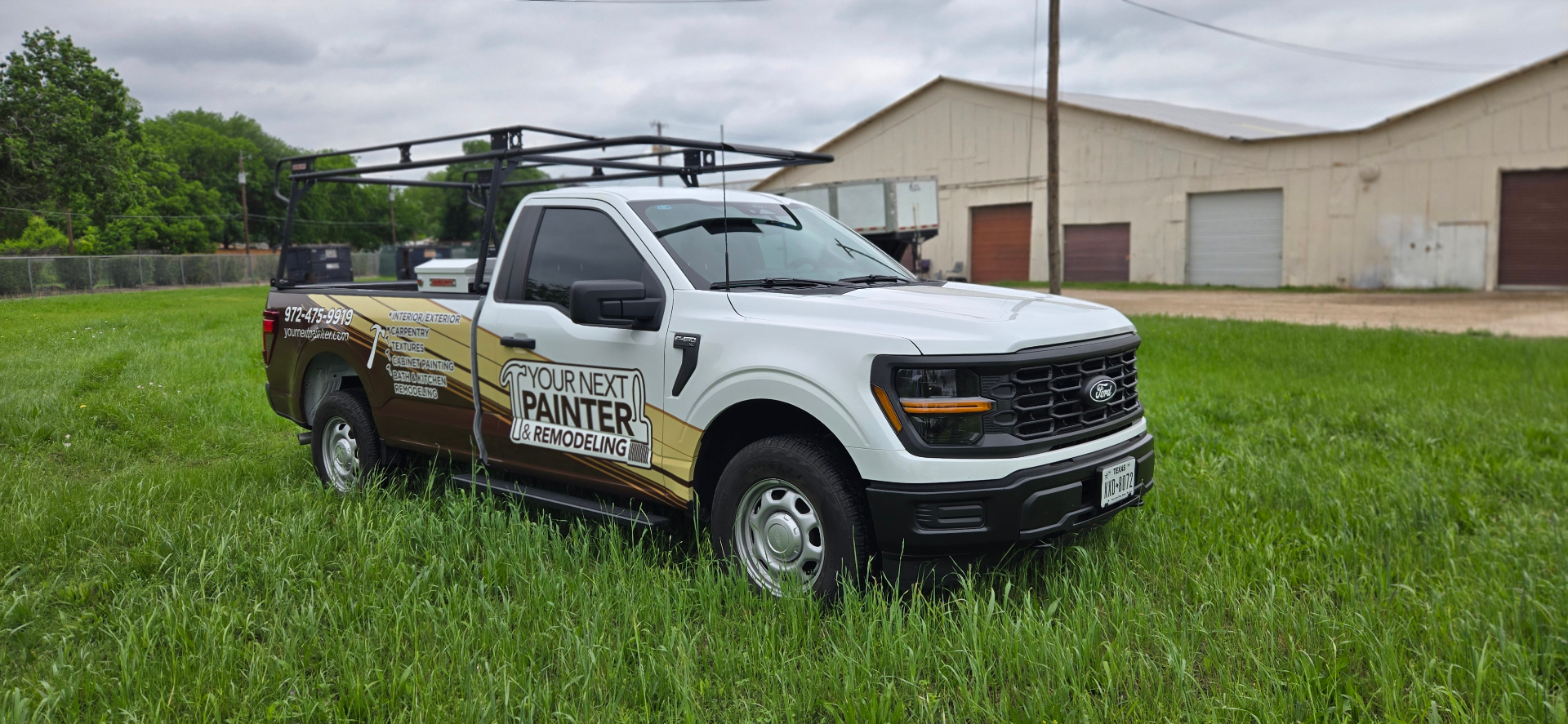 Your Next Painter & Remodeling work truck with ladder rack — front three-quarter view